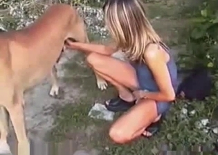 Sexy babe takes care of her doggy