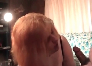 Ginger model is giving a blowjob to an animal